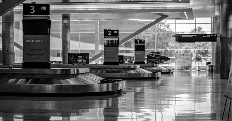 Empty baggage claim area with no passengers