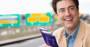 A man holding several boarding passes