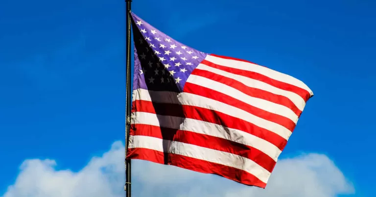 U.S. flag under a clear blue sky