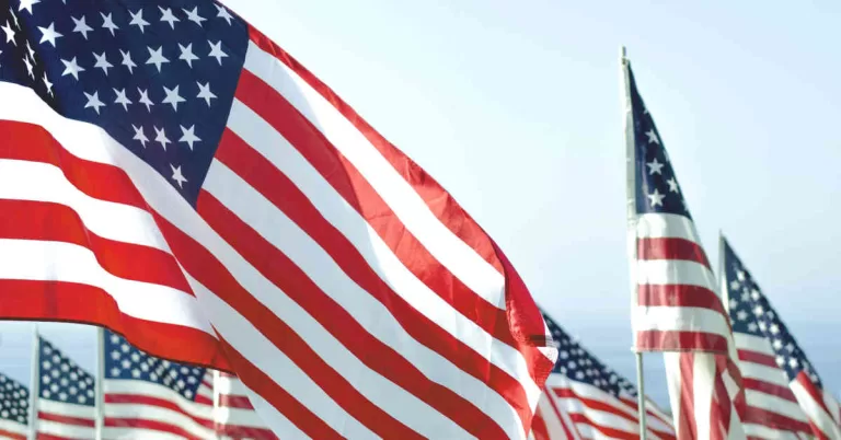 U.S. flags under a clear sky